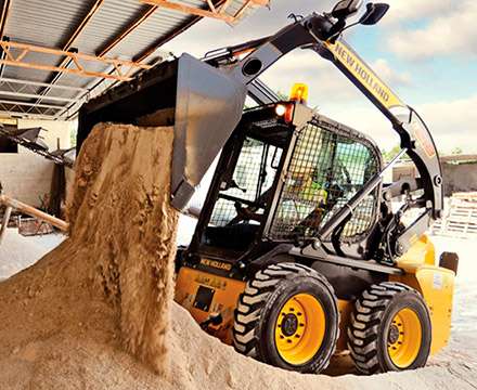 Moving material-skid steer loader